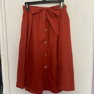 Bought this skirt from Ross. It’s a size L and sort of a red tone.